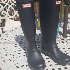 Hunter rain boots.   Mud boots
